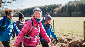 Group of smiley women walking together